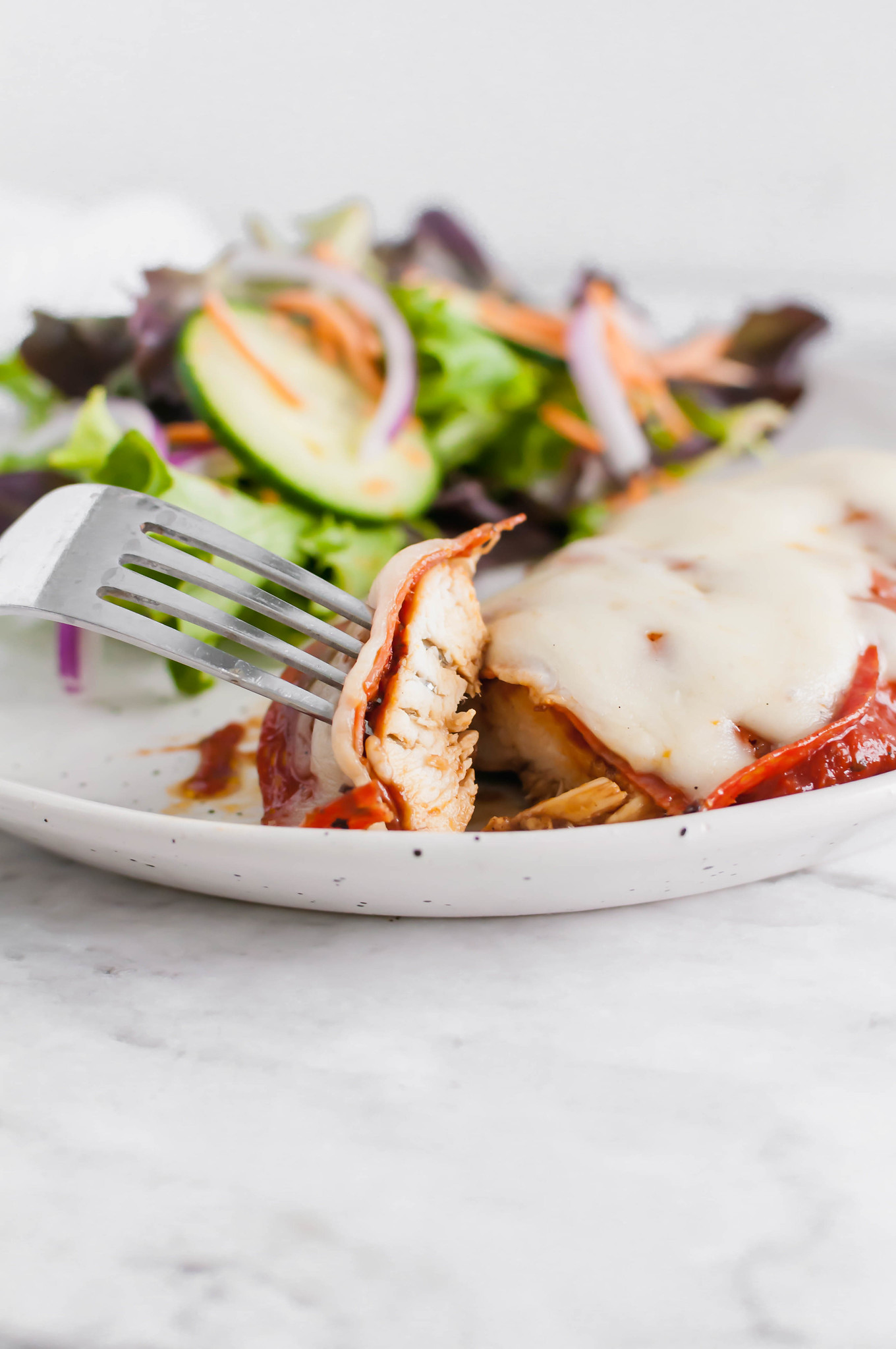 This Pizza Chicken is sure to be a new family favorite. Marinated chicken, grilled to perfection and topped with the best pizza toppings.