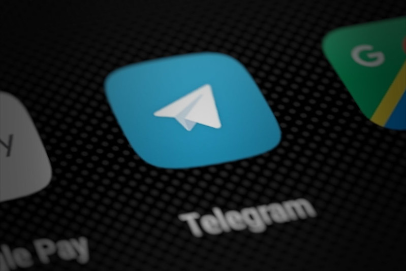Telegram app icon on smartphone screen (perspective render)