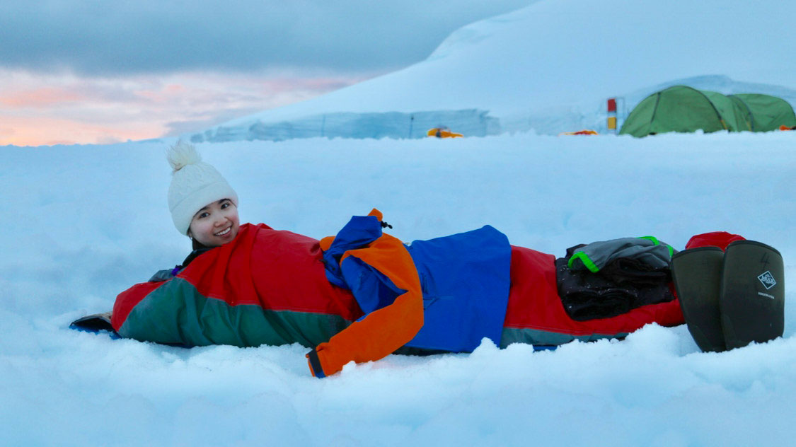Zhuofu Li in a sleeping bag at the Antarctic Base