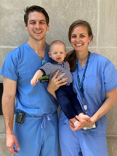 Jordan and Katie Anderson pose with their infant son, Rowan.