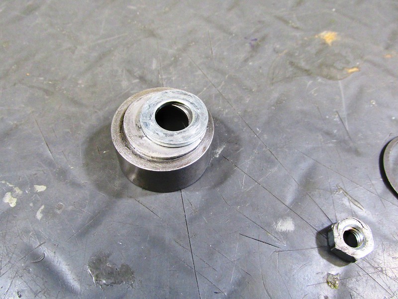 Two Washers on Face of Lower Damper Rod Spring Retainer