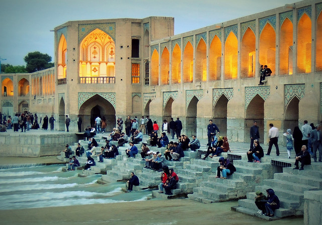 Iran real life by Silk Road era Khaju bridge and Zayandeh river in Isfahan