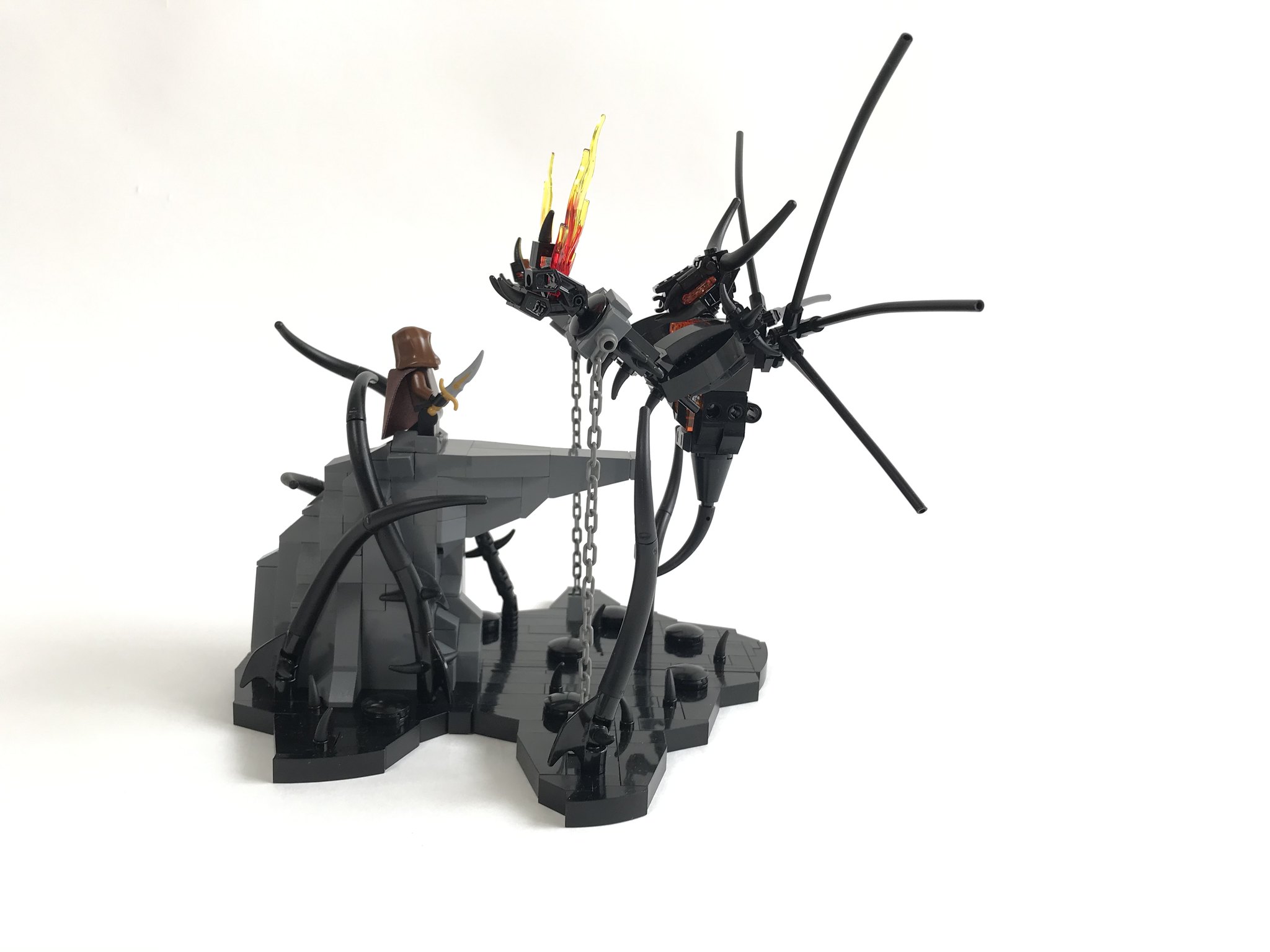LEGO tensegrity sculpture of a demon suspended by only chains. A light brick was used for the glowing effect in the chest.