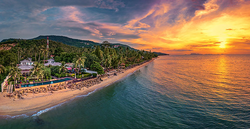 sunset endofday sand sea beach rocks pool villas kohsamui samui palmtrees palms trees hills settingsun twilight clouds sky colours thailand