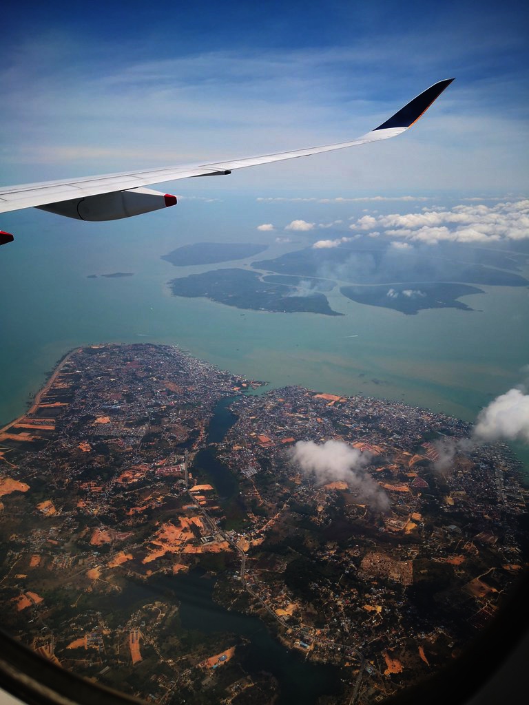 Singapore Airlines A350 flying over an island in Riau archipelago