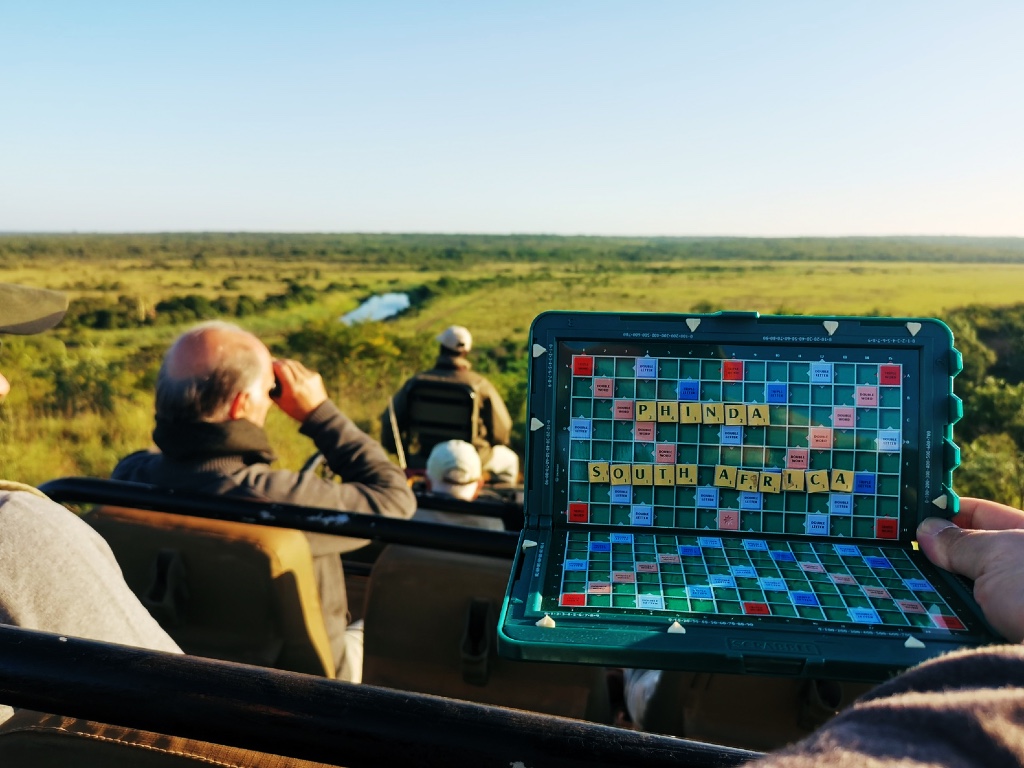 Picture of Scrabble set with the words Phinda, South Africa formed taken in front of beautiful Phinda landscape