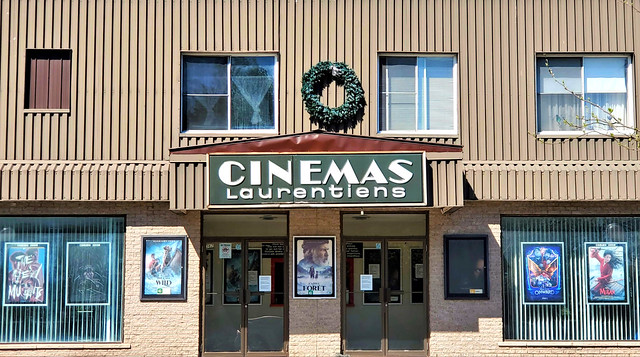 '80s font cinema sign; movie posters from mid-March 2020, frozen in time two months later because of closure due to the coronavirus