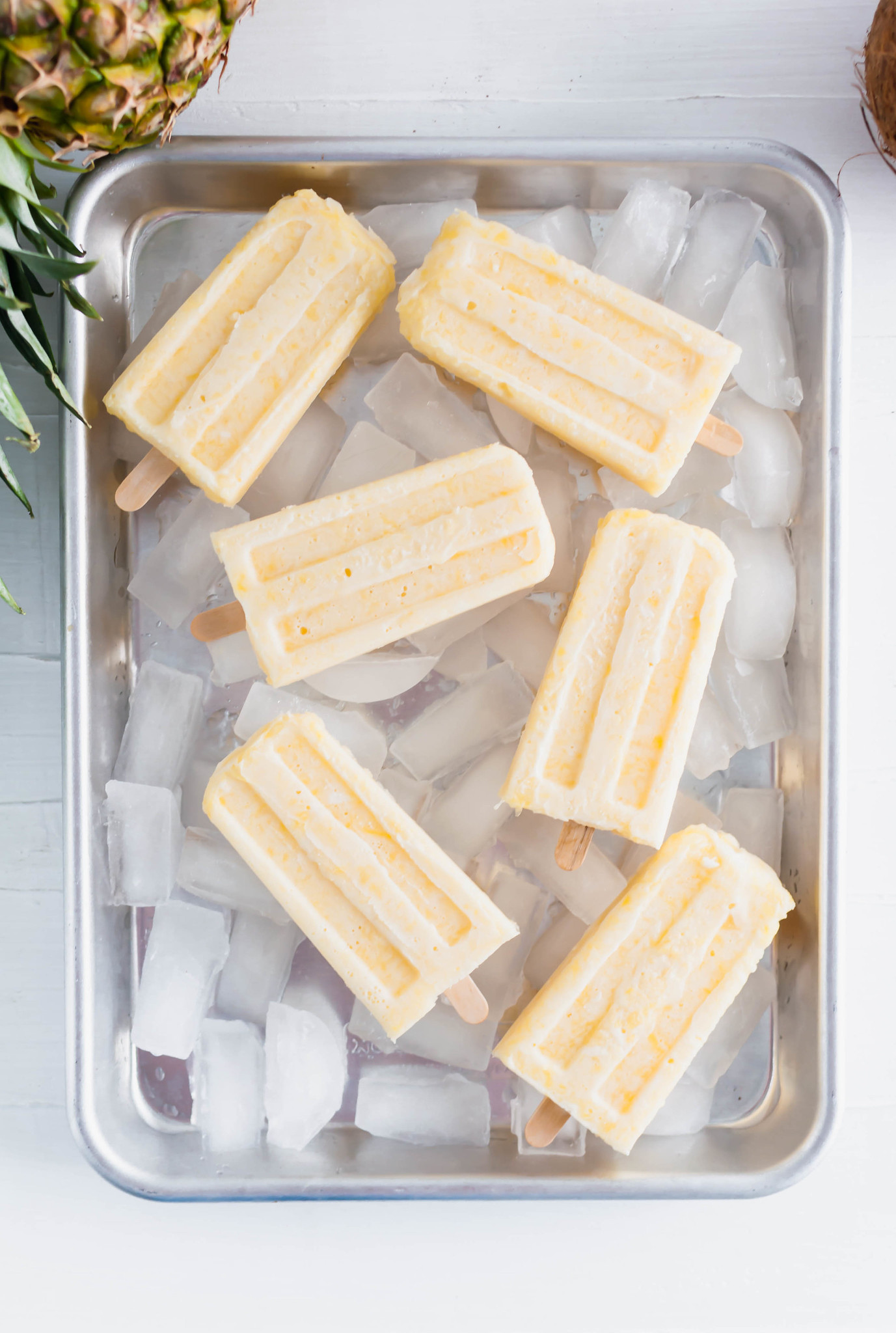 These Pina Colada Popsicles will be the treat of summer. Creamy coconut and sweet pineapple make a simple, delicious dessert that tastes just like the classic drink (without the booze). 