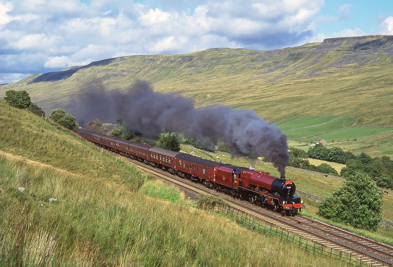 46203 'Princess Margaret Rose' storms along Mallerstang Edge hauling a southbound 'Cumbrian Mountain Express' on August 29th 1994.
( Rescan and process )