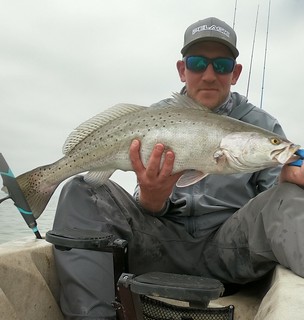 Photo of man with speckled trout.