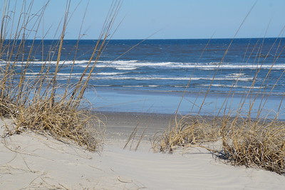 sand path through dunes overlooking Atlantic Ocean