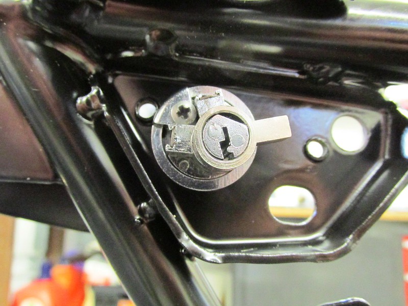 Seat Lock Tumbler Installed in Hole In Sub-Frame