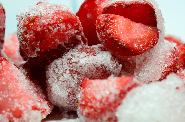 Frozen summer strawberries close up