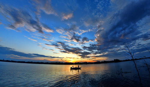 foxriver depere wisconsin musky fisherman boat sunset