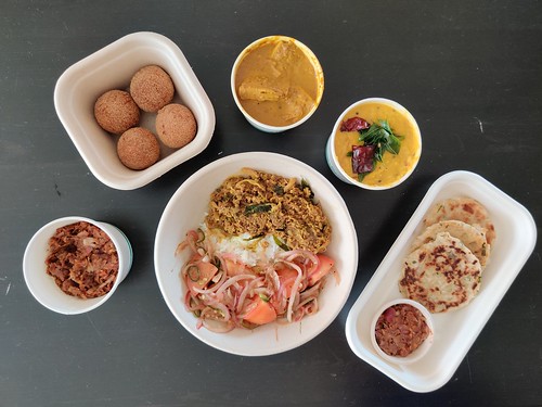 Clockwise from left: lunu miris, crab cutlet, polos, dhal, coconut rotti, gova mallum with tomato sambol