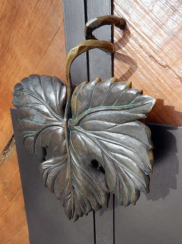 Door pull in the form of a wrought bronze grape leaf at the Mission Hill Winery in West Kelowna, Canada