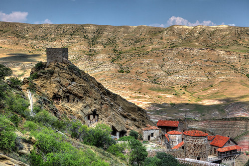 horizontal outdoors nopeople spire church building architecture tower stone cross religion belief hills rock mountain colorful minerals sandstone volcanic rainbowhills hill landscape dry plant green bush roof rooftile rockhewn cavesinrock summer travelling travel colour color hdr highdynamicrange sky cloud bluesky june 2018 vacation canon camera photography canon5dmkii kakheti davidgareja monastery georgia eurasia easterneurope westasia monasterycomplex