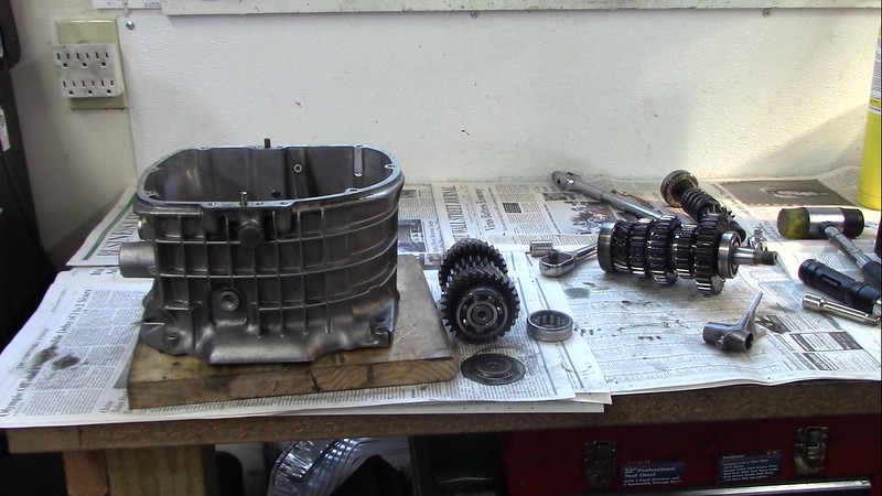 Transmission Shafts, Intermediate Shaft Shift Fork and Input Shaft Outer Bearing Race Removed From Transmission Case