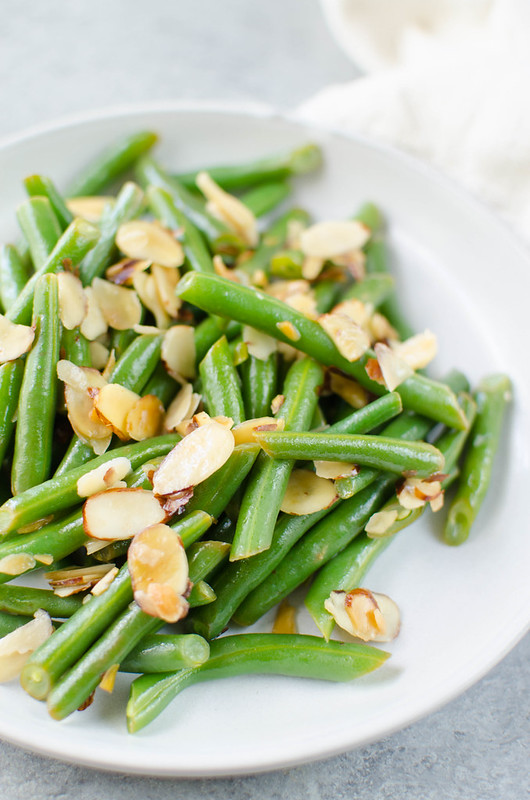 Green Beans Almondine - fresh green beans tossed with buttery toasted almonds and lemon juice. A quick, simple, and delicious side dish. 