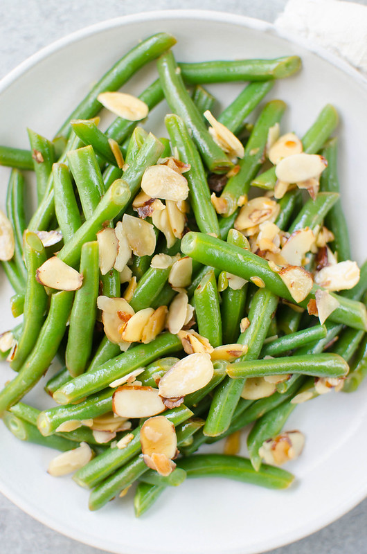 Green Beans Almondine - fresh green beans tossed with buttery toasted almonds and lemon juice. A quick, simple, and delicious side dish. 