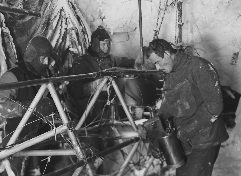 Bickerton repairs the Air-tractor, Antarctica, 1912-1913, Frank Hurley