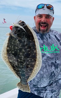 Rich Watts holds up a good sized flounder