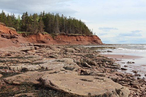 lowerbedeque pei canada beach shore rocks cliff water