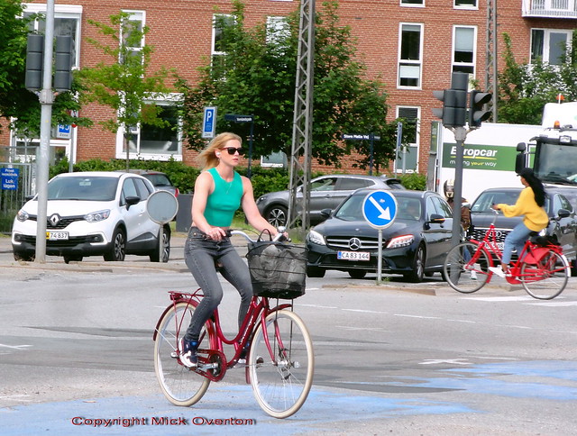 9.30am and a Copenhagen summer girl cycles towards the beach