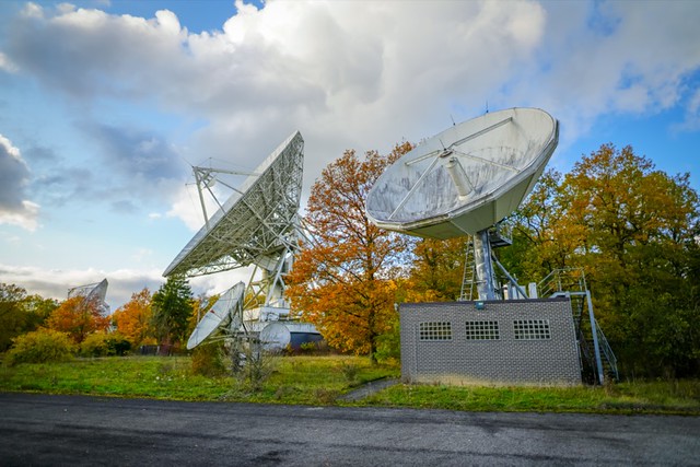 Station terrienne de télécommunications spatiales de Lessive, Belgique - Telecommunication parabolic antenna and infrastructure in the middle of the forest in Lessive, Belgium - Ben Heine Photography