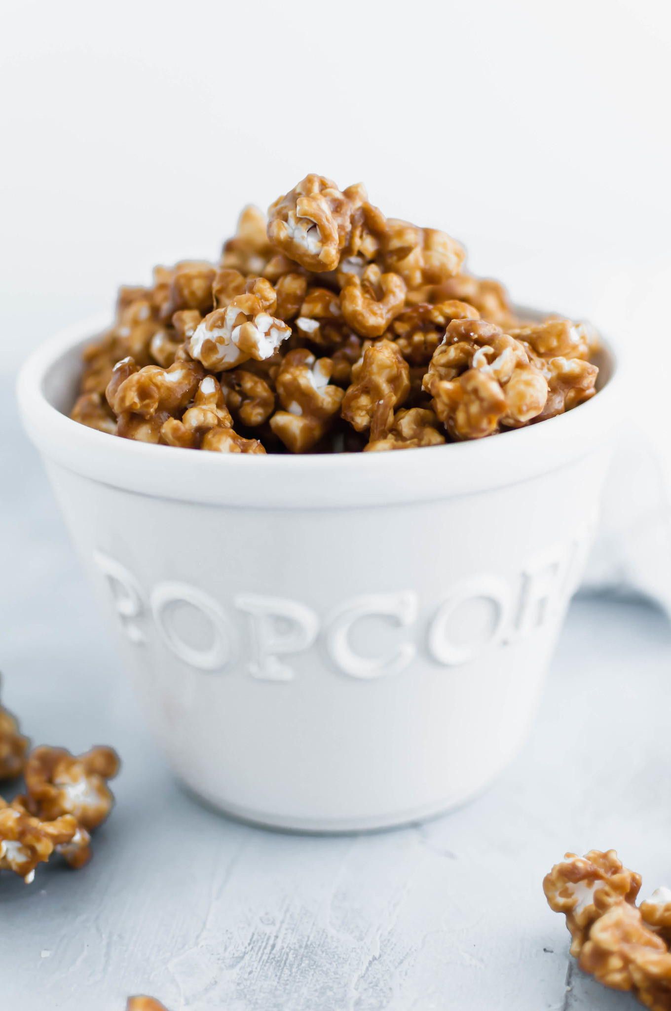 Salted caramel popcorn is the perfect addition to a party or movie night. It features a simple homemade caramel sauce, freshly popped popcorn and a hearty sprinkle of coarse salt.