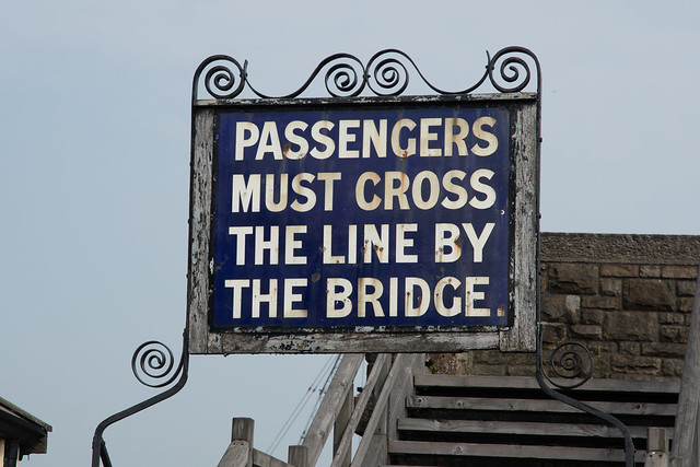 Passengers must cross the line by the bridge