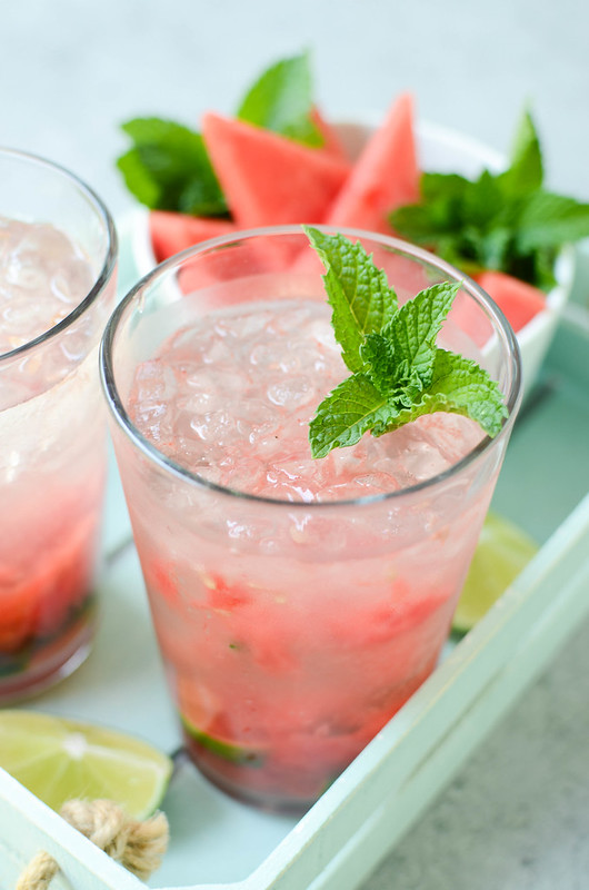 Watermelon Mojitos - fresh mint, watermelon, and limes muddled together and topped with rum and sparking water. One of my favorite summer drinks!