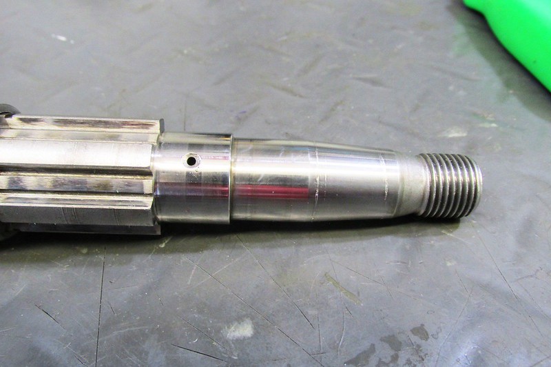 Scoring On Taper Of Output Shaft Caused By Vestigial Machining Marks On The Output Flange