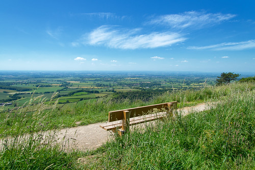 sutton bank north york moors national park centre yorkshire uk panorama vista view hills landscape suttonbank bluesky sky fields sunny england northyorkshire nikon d600 spectacular bench seat chair parkbench beautiful horizon countryside country