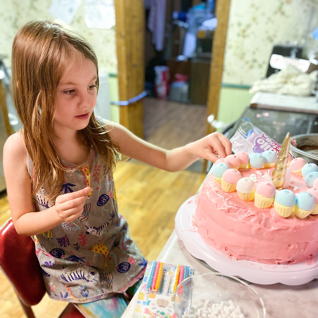 Decorating her cake