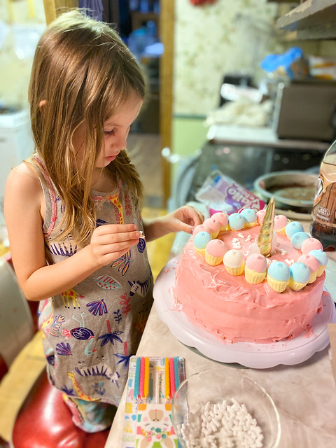 Decorating her cake