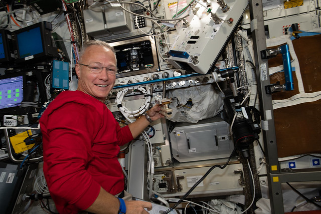 Expedition 63 Flight Engineer Doug Hurley works on science hardware