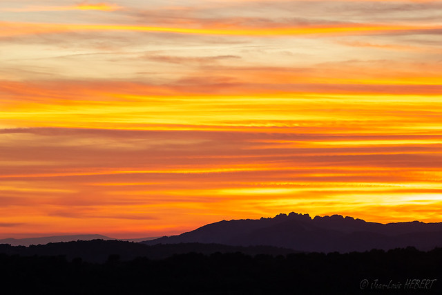 Sunset over the jagged peaks of Dentelles de Montmirail