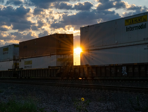 saginaw tx texas container stacks intermodal wellcars sunset rays sunflower rails train