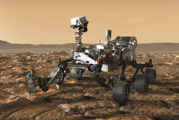 An artist’s concept depicts NASA’s Mars rover exploring the red planet. It is set for launch this summer.