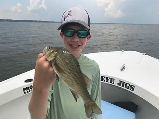 Photo of boy holding a white perch