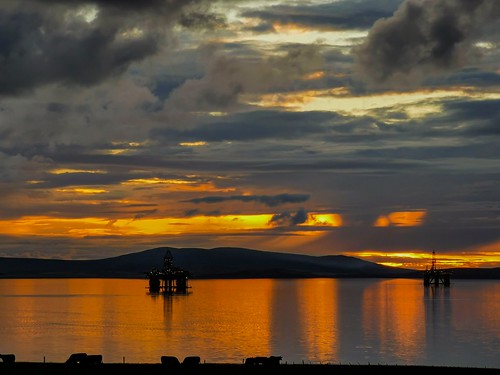 orkney scapaflow drillingrigs platform sunset sea dramaticsky