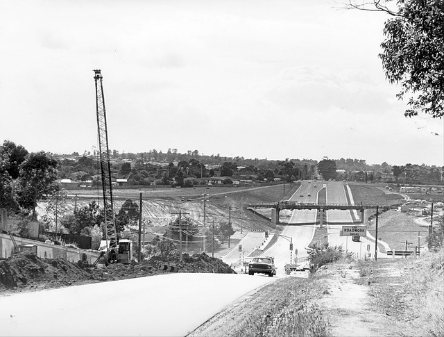 View along Ferntree Gully Road looking east twoards Mulgrave (Monash) Freeway overpass under construction, circa 1970s