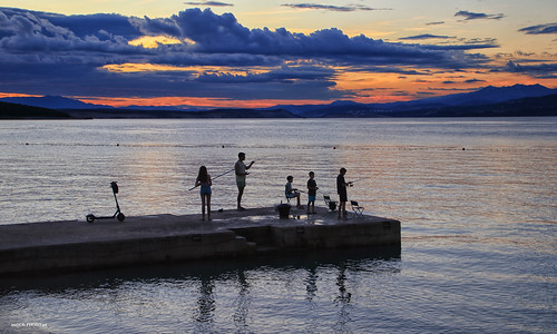 dock sea shore sun coast sunset dusk seaside silhouettes sky clouds twilight people fishing canon croatia hrvatska europe adriatic