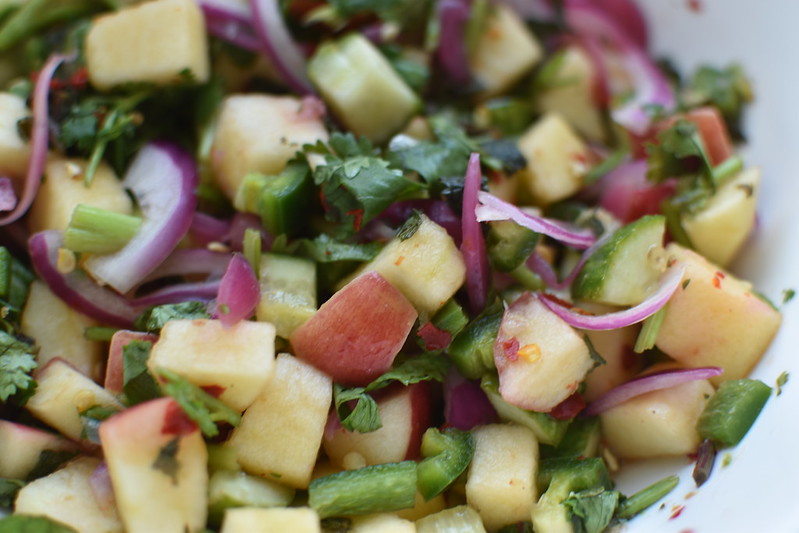 Apple and cucumber salad with green peppers and herbs
