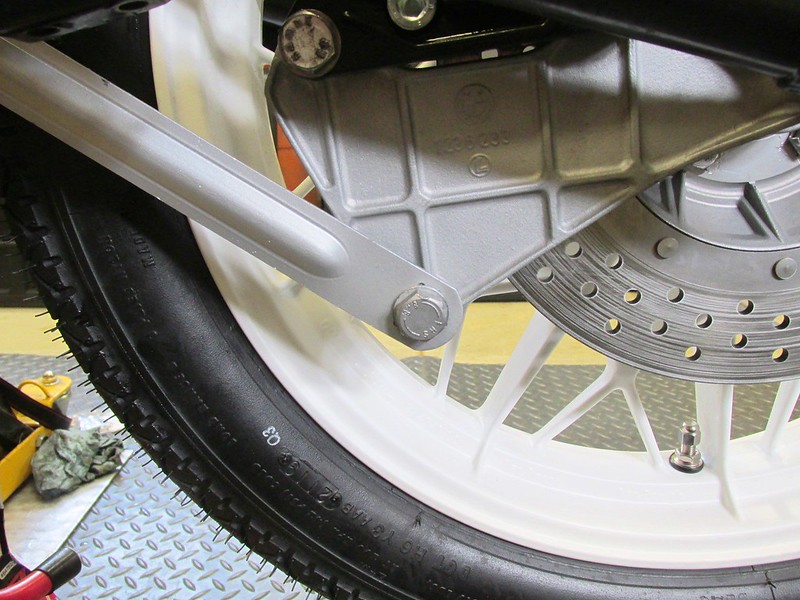 Brake Stay Mounted To Bottom Of Caliper Mounting Plate