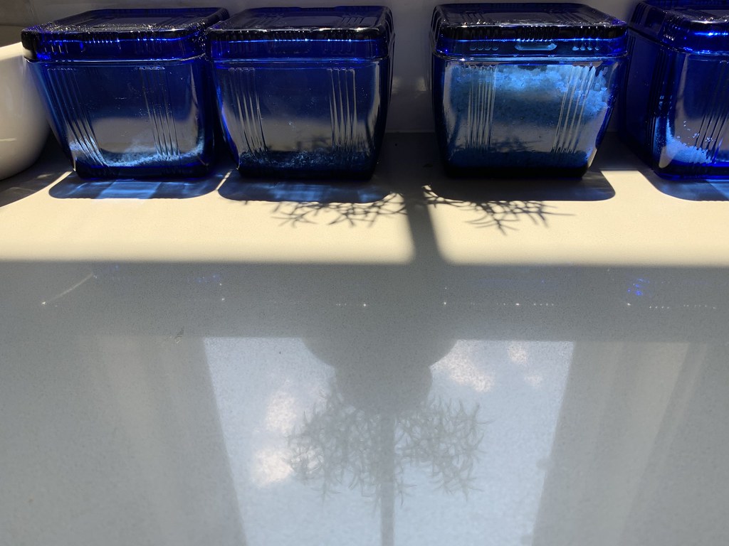 Blue glass containers on the kitchen counter