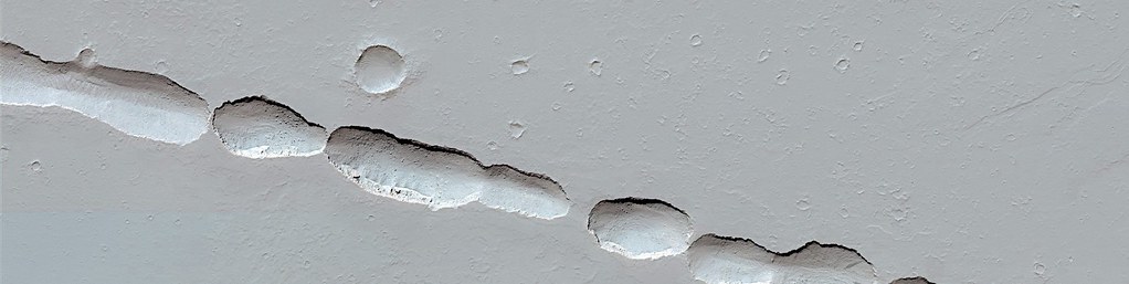 Mars - Chain of Collapse Pits Near Olympica Fossae