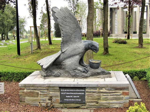 statue of eagle standing in front of the Mardasson Memorial