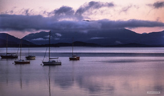 Morning cloud shrouds Ben Lomond, across the iconic waters of Loch Lomond, in late summer.